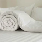 Stai lavando il piumone in lavatrice? Attenzione al peso bagnato: potresti romperla